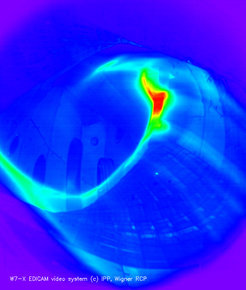 Plasma discharge in the upgraded vessel (coloured black-and-white photo).