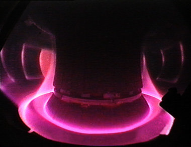 View of the many million degrees hot plasma of the ASDEX Upgrade fusion device at Garching. The plasma edge is guided to the specially equipped divertor plates at the bottom