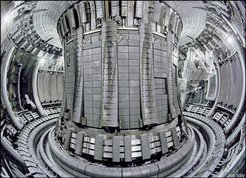The newly clad plasma vessel: 4,500 carbon tiles have been replaced by beryllium and tungsten tiles using the Remote Handling Manipulator Arm (right hand side in the background)