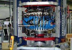 WEGA with removed peripherie. Visible are the blue toroidal field coils and red insulated vertical magnetic coils