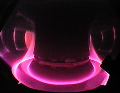 View of the many million degrees hot plasma of the ASDEX Upgrade fusion device at Garching. The plasma edge is guided to the specially equipped divertor plates at the bottom