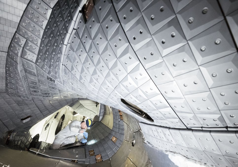 View inside the plasma vessel with graphite tile cladding.