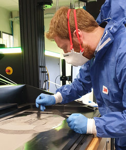 A laser beam melts tungsten powder layer by layer into the pattern of the desired grid structure.